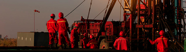 Workers at oil drilling platform